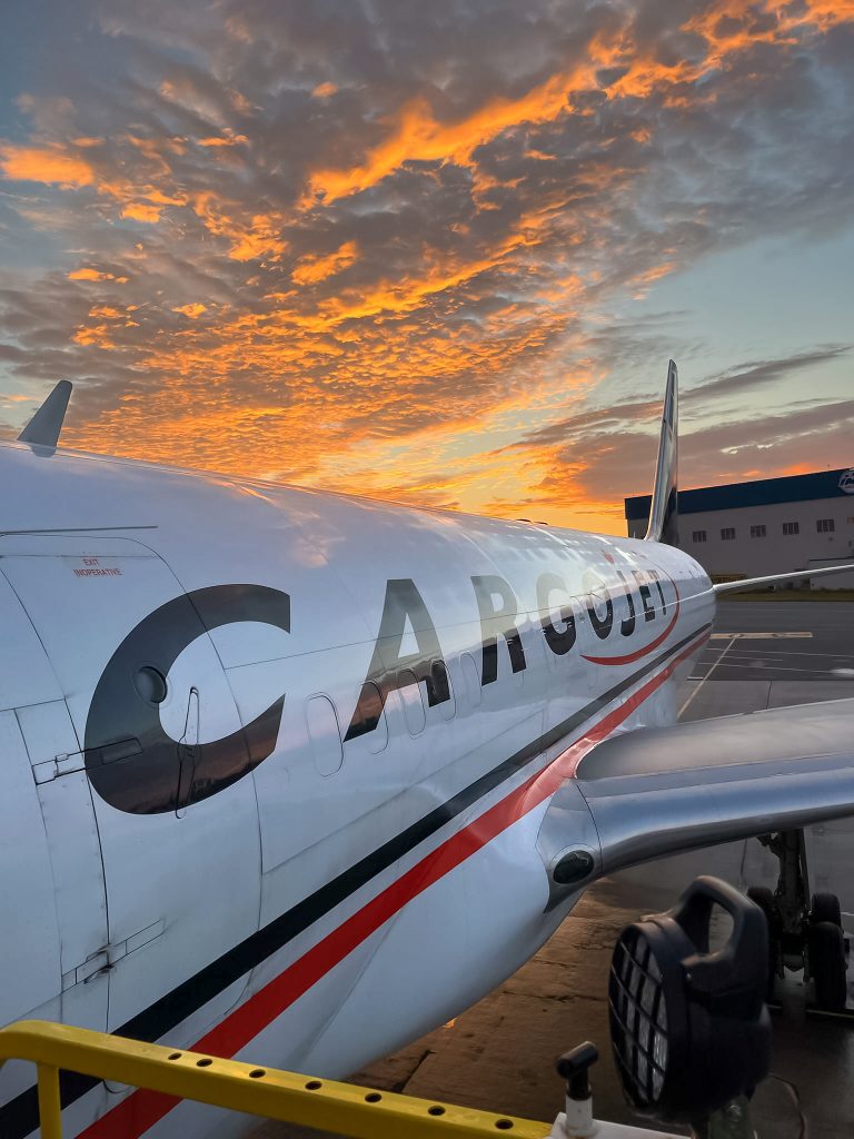 Shot of Cargojet with sunset in the background.